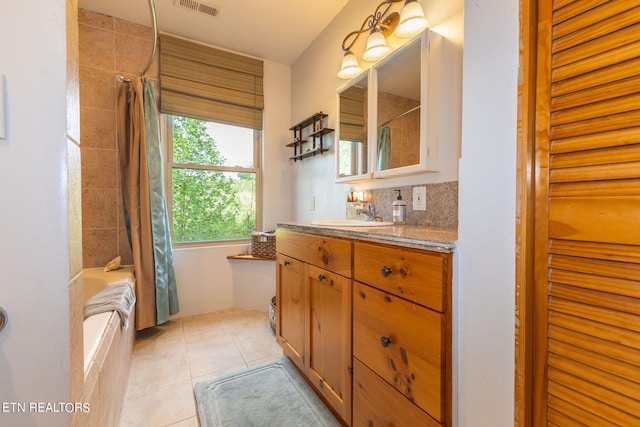 bathroom featuring tile flooring, shower / tub combo, vanity, and tasteful backsplash