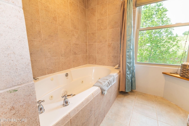 bathroom with a wealth of natural light and tile floors