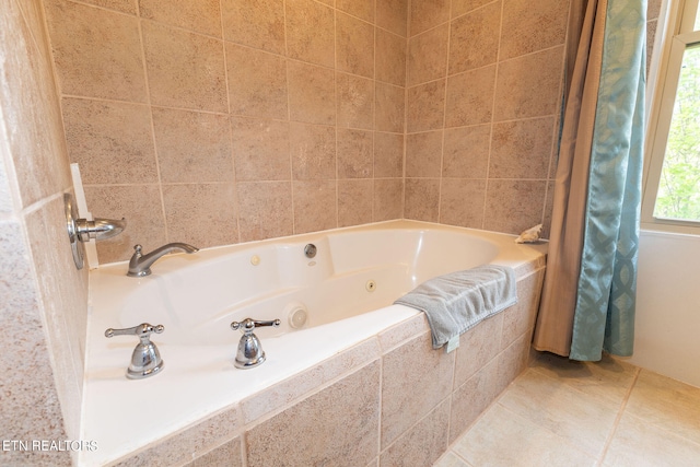 bathroom featuring tile flooring and tiled tub