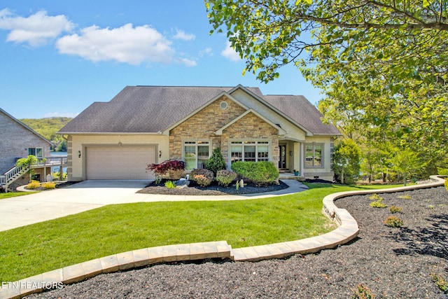 view of front of home featuring a garage and a front lawn