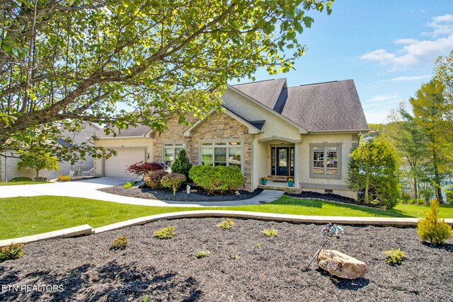 view of front of home with a garage and a front lawn