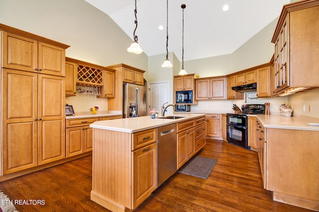 kitchen with pendant lighting, dark wood-type flooring, black appliances, sink, and a center island with sink