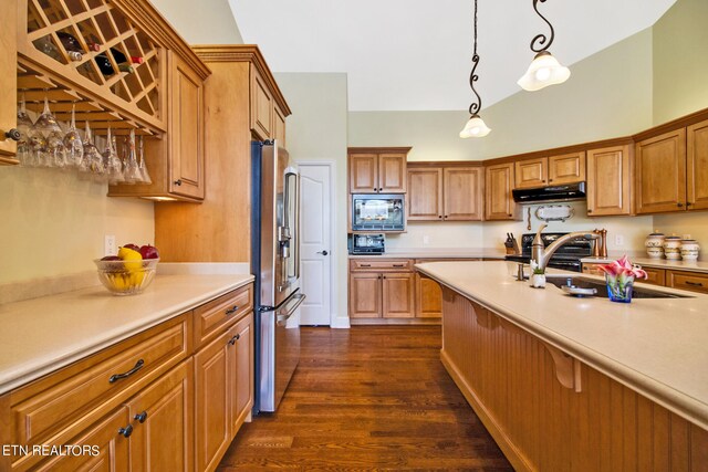 kitchen with pendant lighting, dark hardwood / wood-style floors, appliances with stainless steel finishes, a kitchen bar, and exhaust hood