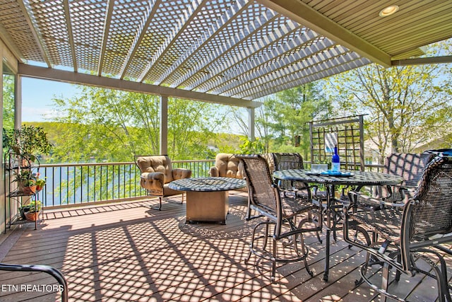 view of terrace with a wooden deck and a pergola