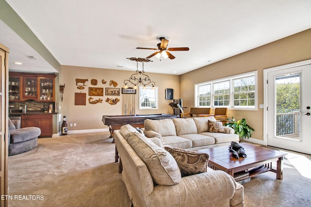 living room featuring ceiling fan, carpet floors, and pool table