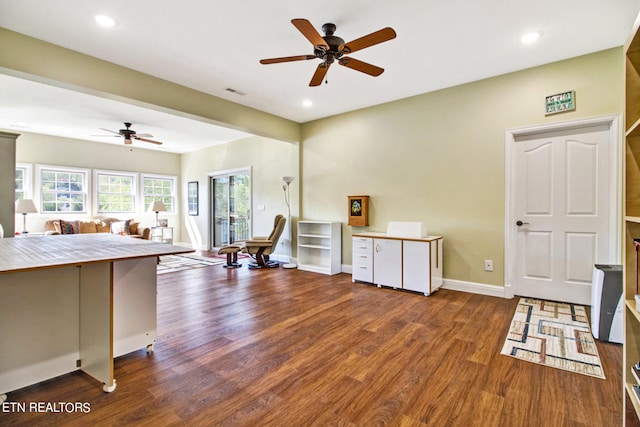 kitchen with white cabinets, ceiling fan, and hardwood / wood-style flooring