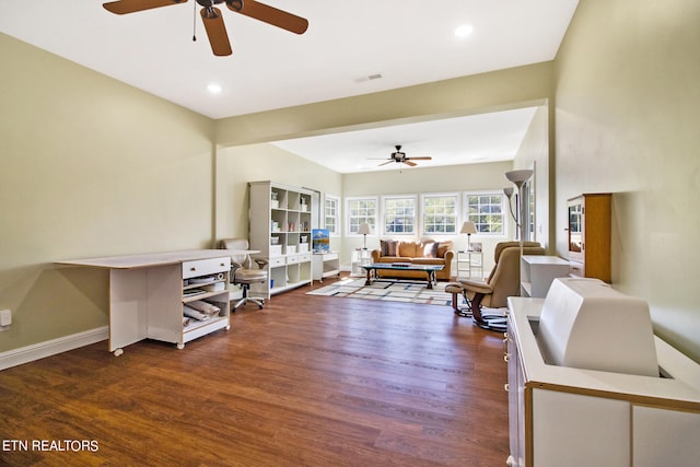 living room featuring dark hardwood / wood-style flooring and ceiling fan