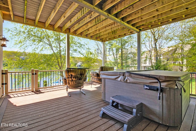 deck featuring a hot tub