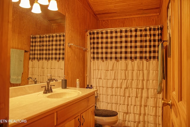 bathroom with wood ceiling, oversized vanity, and toilet