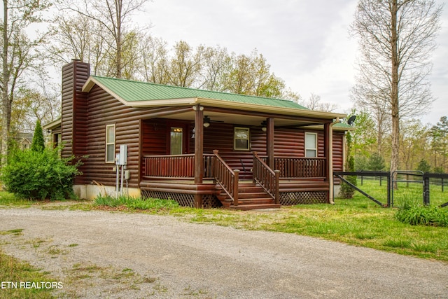 cabin featuring a porch