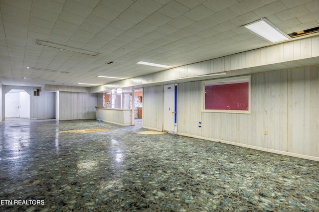 basement with wood walls