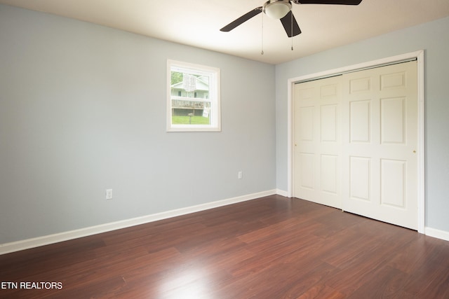 unfurnished bedroom featuring a closet, hardwood / wood-style floors, and ceiling fan