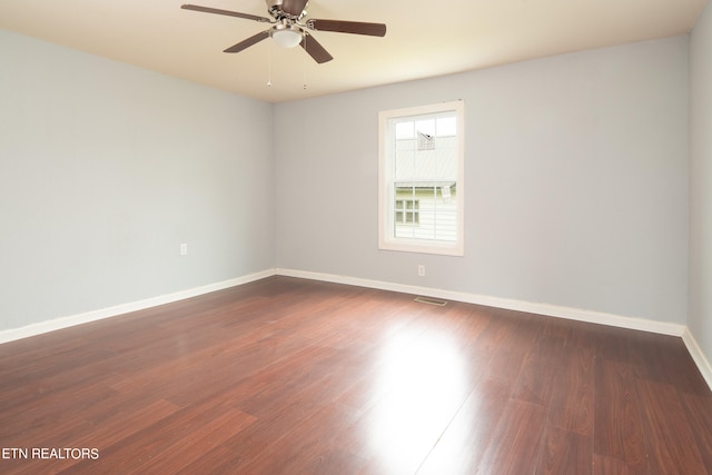 spare room with ceiling fan and hardwood / wood-style flooring