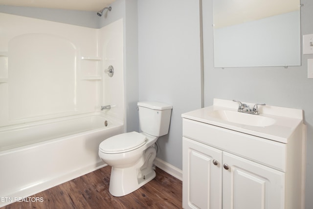 full bathroom with oversized vanity, hardwood / wood-style floors, tub / shower combination, and toilet