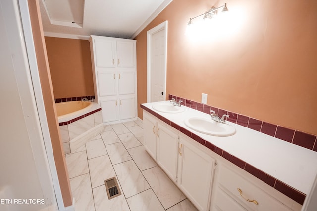 bathroom featuring tiled bath, tile flooring, lofted ceiling, and double sink vanity