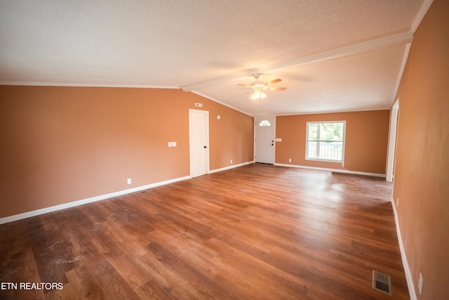 unfurnished room featuring wood-type flooring, ornamental molding, vaulted ceiling, ceiling fan, and a textured ceiling