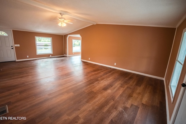 spare room featuring ceiling fan, a textured ceiling, dark hardwood / wood-style flooring, lofted ceiling, and ornamental molding