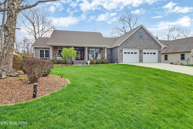 57 Inwood Ter, Crossville, TN 38558 - view of front of house featuring concrete driveway, an attached garage, a front lawn, brick siding, and a porch
