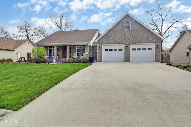 57 Inwood Ter, Crossville, TN 38558 - view of front of property with driveway, a front lawn, brick siding, a porch, and a garage