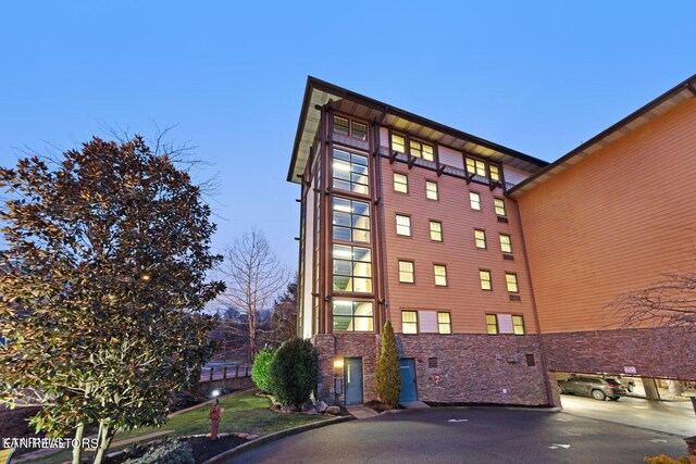 view of outdoor building at dusk