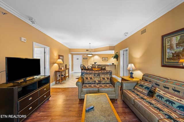 living room featuring ornamental molding and hardwood / wood-style floors