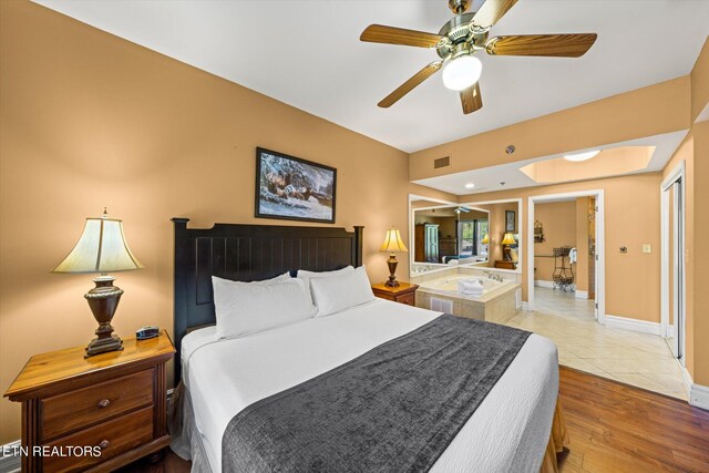 tiled bedroom with ceiling fan