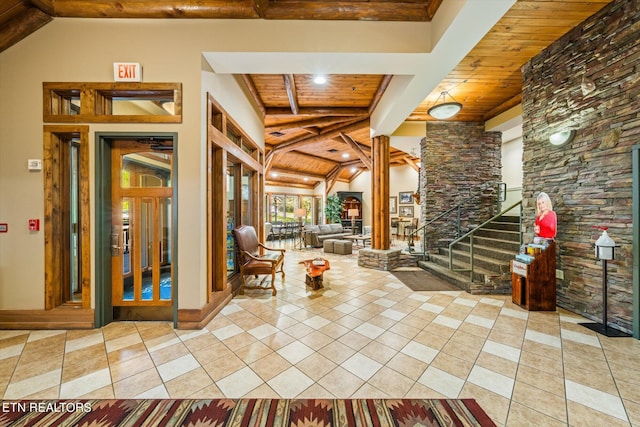 interior space with lofted ceiling with beams, tile flooring, and wooden ceiling