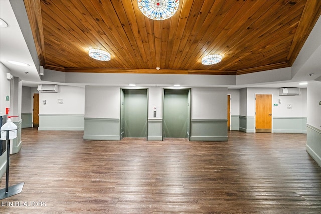 spare room with wood-type flooring, elevator, and wood ceiling