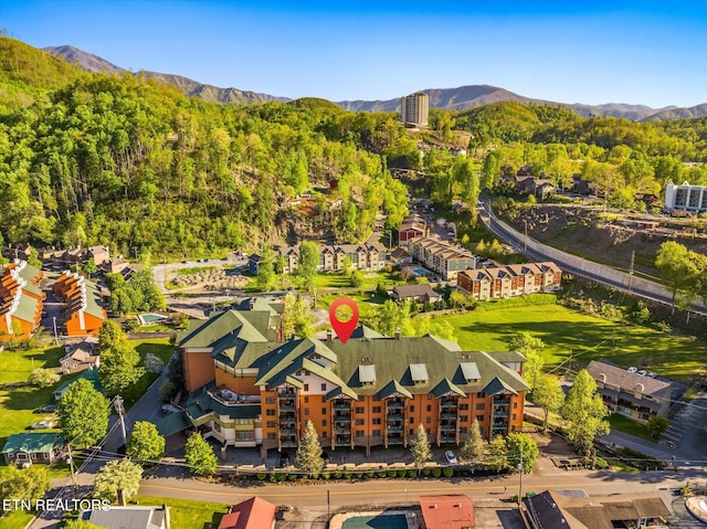 birds eye view of property with a mountain view