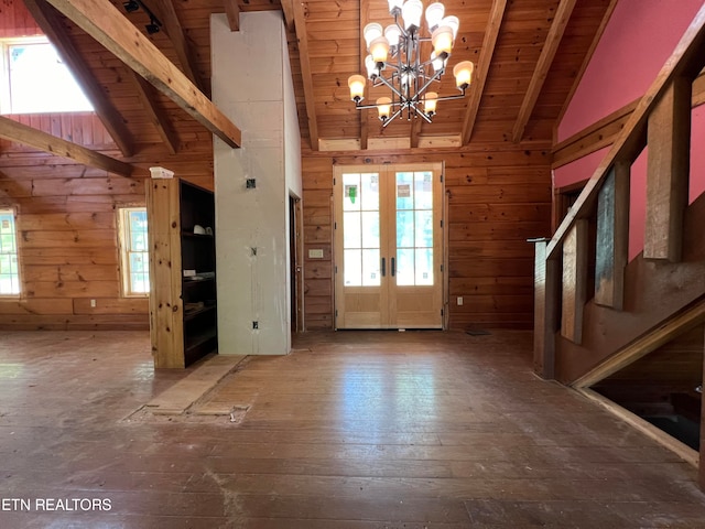 foyer with vaulted ceiling with beams, wood walls, hardwood / wood-style flooring, and wood ceiling