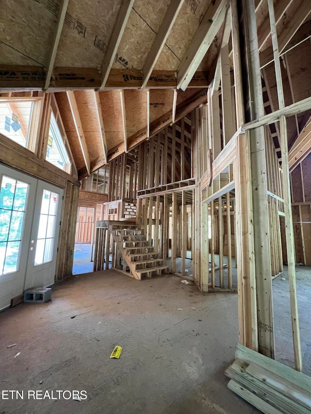 miscellaneous room with a high ceiling and french doors