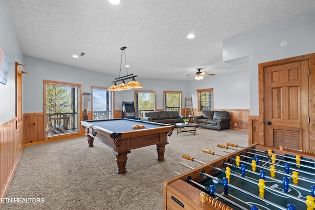 rec room with a wealth of natural light, a textured ceiling, pool table, and carpet floors