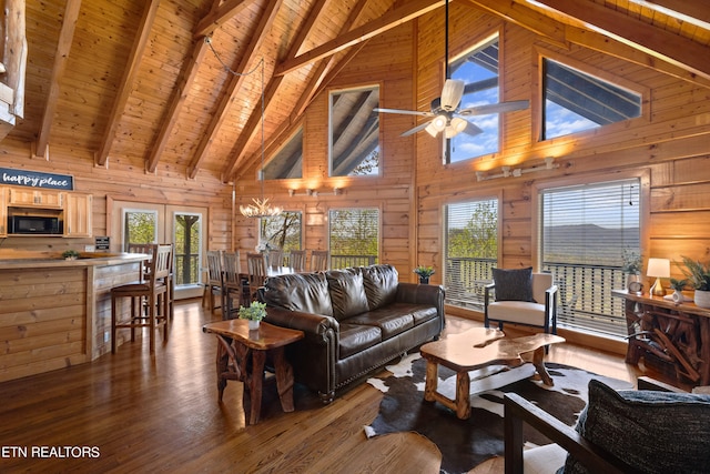 living room featuring high vaulted ceiling, wood walls, and wood ceiling