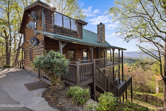 cabin featuring covered porch