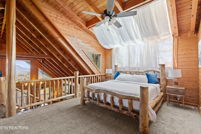 unfurnished bedroom featuring wooden walls, lofted ceiling with beams, carpet flooring, wood ceiling, and ceiling fan