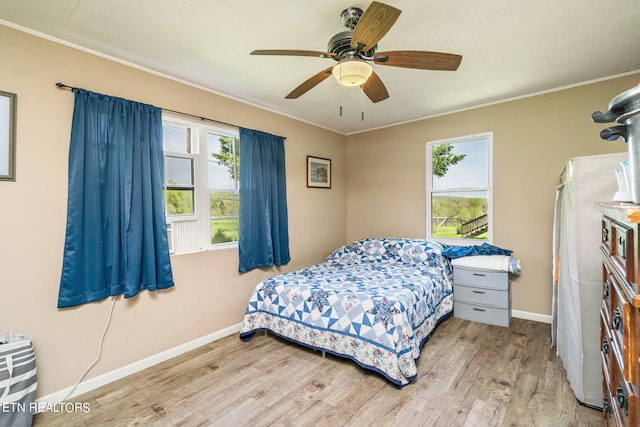 bedroom with ceiling fan and light wood-type flooring