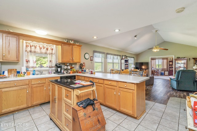 kitchen featuring a wealth of natural light, ceiling fan, and light tile floors