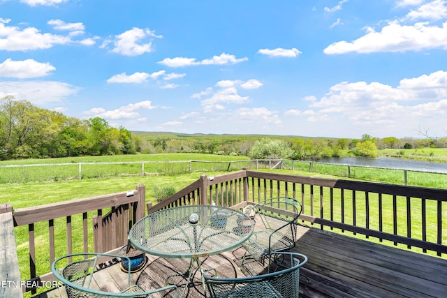 deck featuring a yard and a water view