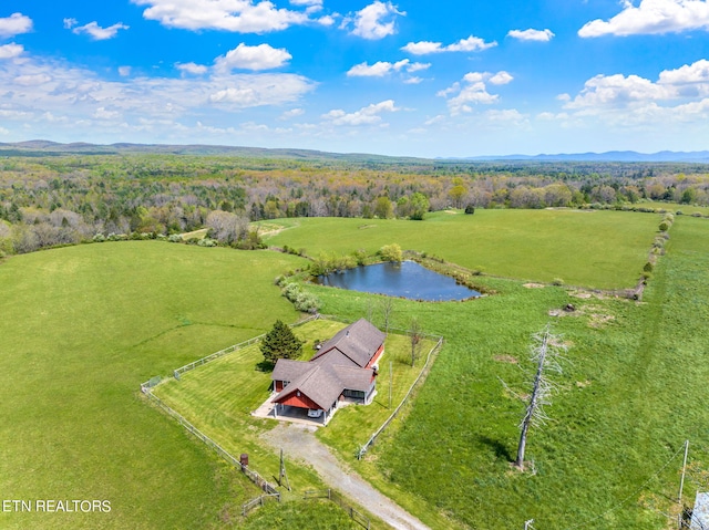 drone / aerial view featuring a water view and a rural view