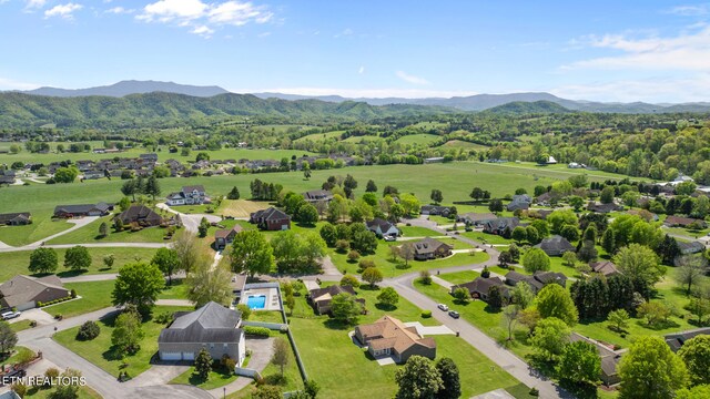 birds eye view of property featuring a mountain view