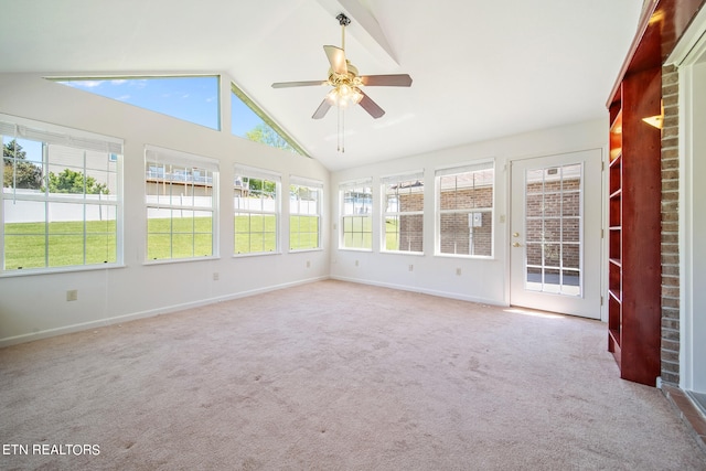 unfurnished sunroom featuring ceiling fan and vaulted ceiling