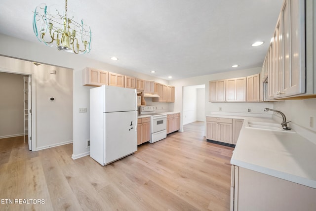 kitchen with light brown cabinets, white appliances, light hardwood / wood-style floors, and sink