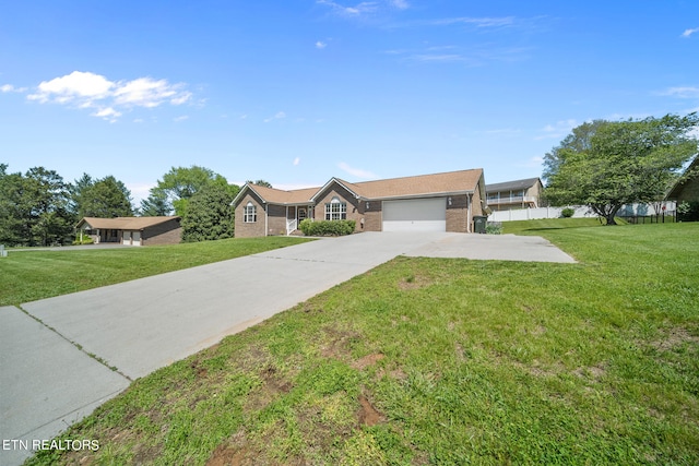 ranch-style home featuring a front yard and a garage