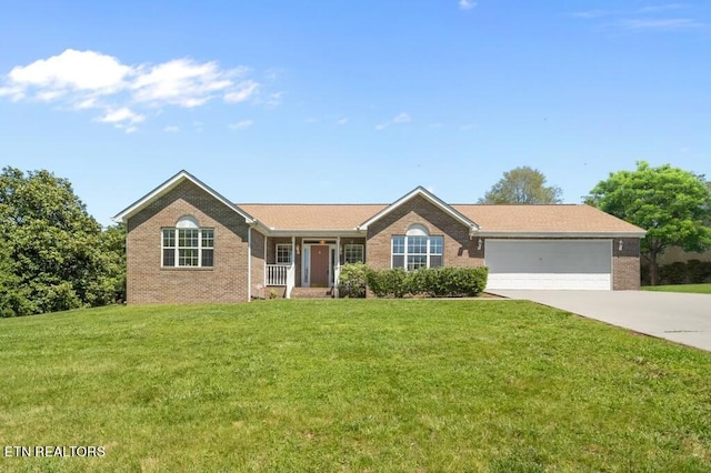 ranch-style home with a front yard and a garage