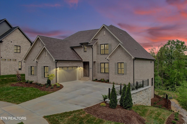 french country home featuring a garage