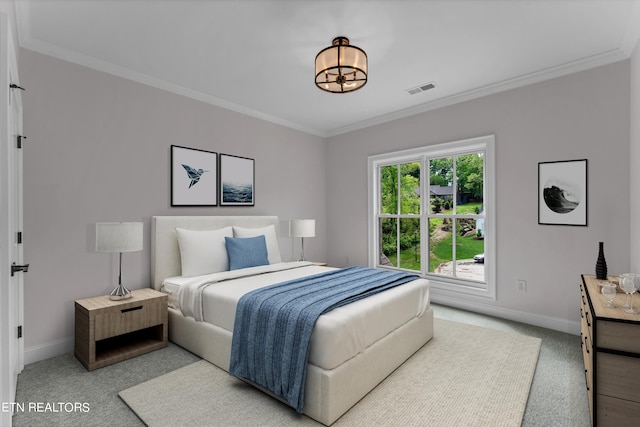 bedroom with ornamental molding and carpet flooring