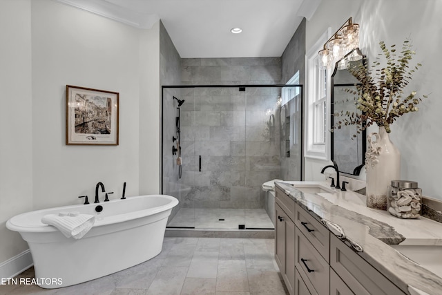 bathroom featuring vanity and plus walk in shower