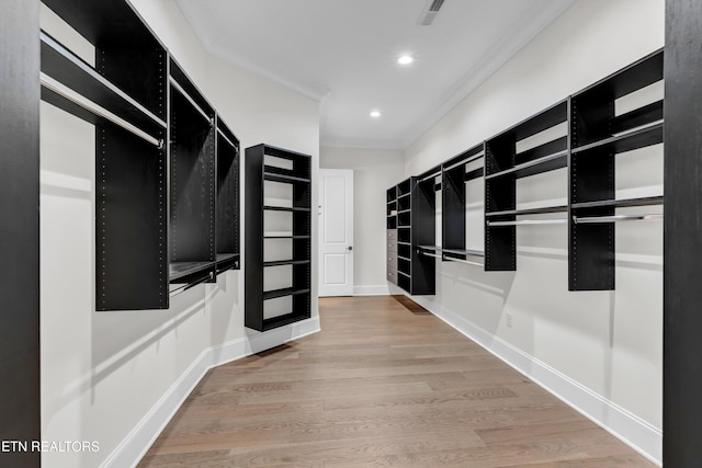 walk in closet featuring hardwood / wood-style floors