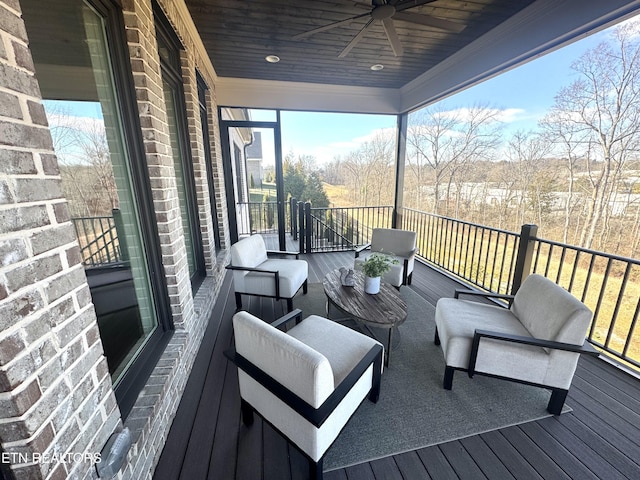 wooden deck featuring ceiling fan and outdoor lounge area