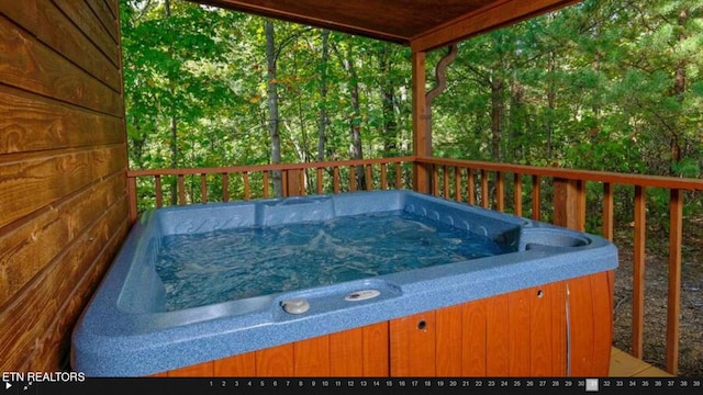 deck with a hot tub